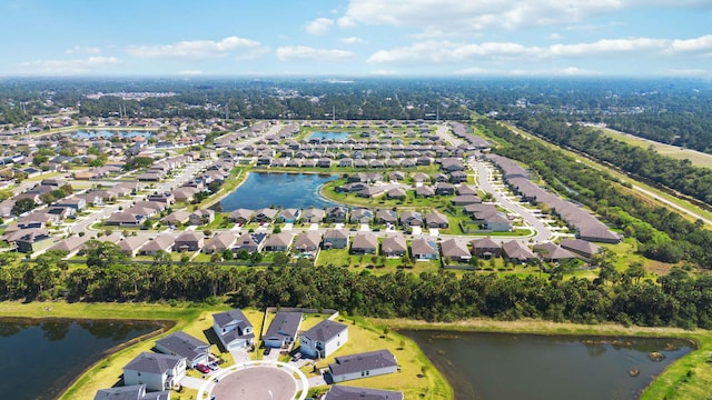 birds eye view of property featuring a residential view and a water view