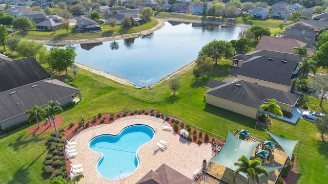 drone / aerial view featuring a residential view and a water view