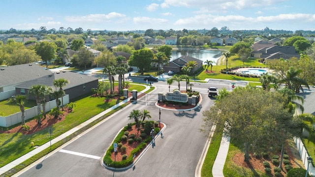 drone / aerial view with a residential view and a water view