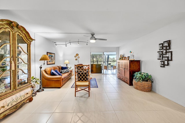 living room featuring light tile patterned floors and ceiling fan