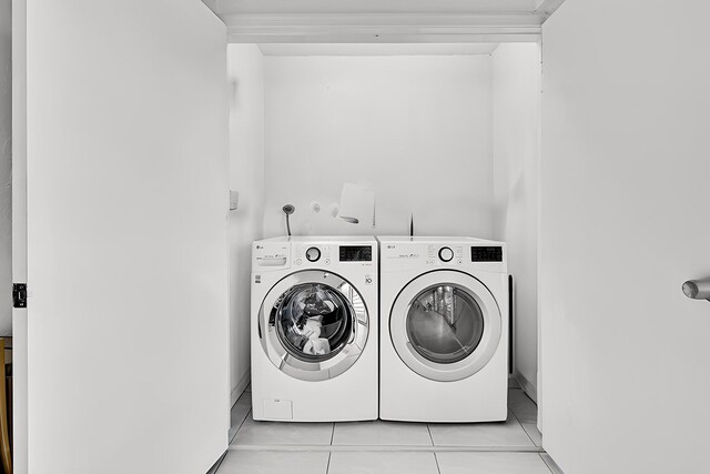 laundry area with tile patterned floors, laundry area, and separate washer and dryer