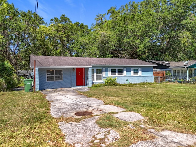 1201 Susan St, Leesburg, FL 34748 - single story home featuring concrete driveway, fence, and a front lawn