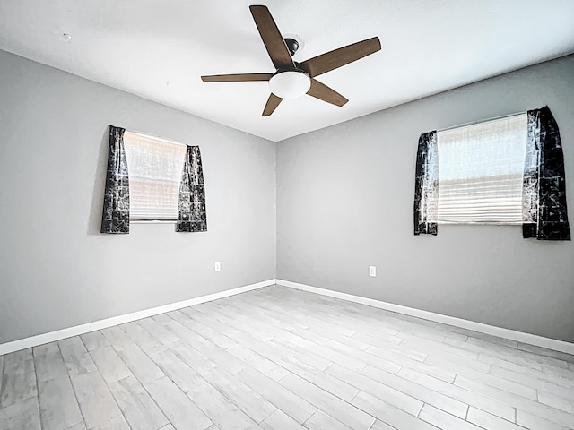 1201 Susan St, Leesburg, FL 34748 - empty room featuring baseboards, a ceiling fan, and wood finished floors