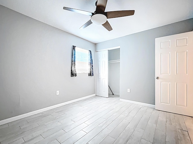 1201 Susan St, Leesburg, FL 34748 - unfurnished bedroom featuring light wood-type flooring, a closet, baseboards, and a ceiling fan