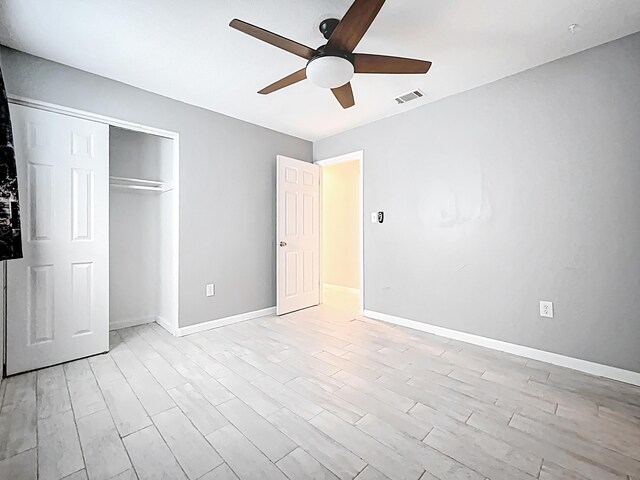 1201 Susan St, Leesburg, FL 34748 - unfurnished bedroom featuring light wood-style floors, visible vents, baseboards, and a closet