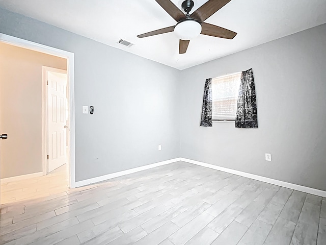 1201 Susan St, Leesburg, FL 34748 - empty room with visible vents, baseboards, a ceiling fan, and wood finished floors