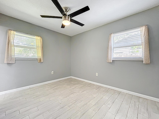 1201 Susan St, Leesburg, FL 34748 - spare room with plenty of natural light, light wood-style flooring, baseboards, and a ceiling fan