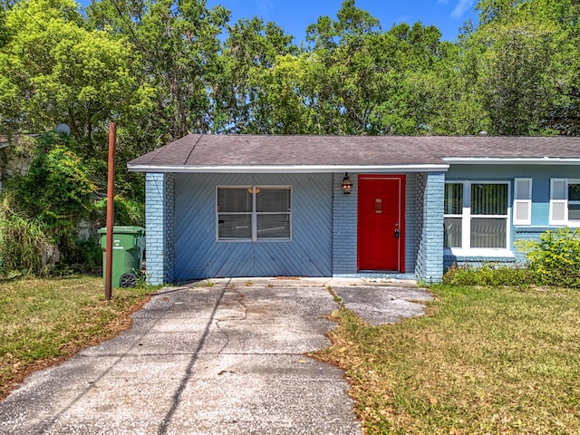 1201 Susan St, Leesburg, FL 34748 - ranch-style house with brick siding and a front lawn