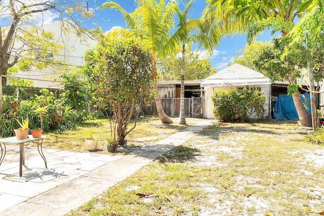 view of yard featuring a patio and fence