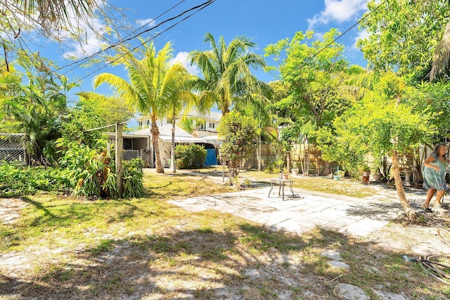 view of yard with a patio area and fence