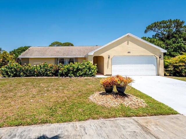 1821 SE Hanby Ave, Port Saint Lucie, FL 34952 - ranch-style house featuring a garage, a front lawn, concrete driveway, and stucco siding