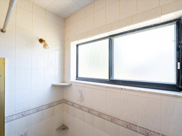 1821 SE Hanby Ave, Port Saint Lucie, FL 34952 - bathroom with plenty of natural light and a tile shower