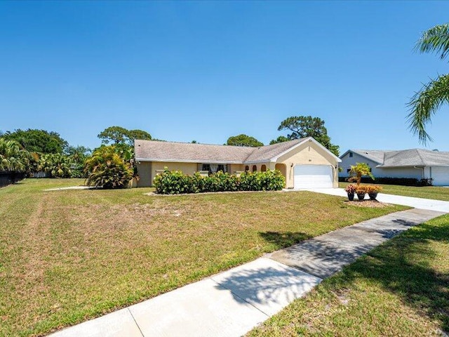 1821 SE Hanby Ave, Port Saint Lucie, FL 34952 - ranch-style house with a garage, a front yard, and concrete driveway