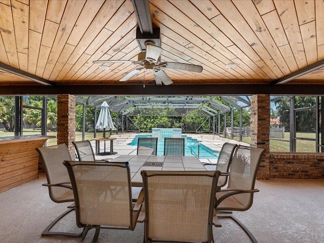 1821 SE Hanby Ave, Port Saint Lucie, FL 34952 - view of patio with glass enclosure, an outdoor pool, a ceiling fan, and outdoor dining space