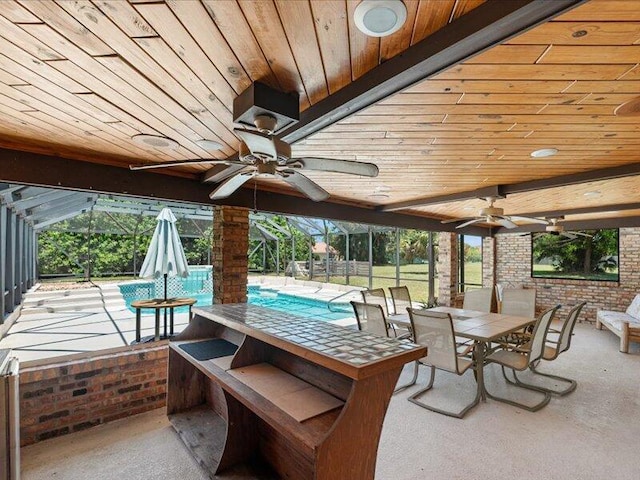 1821 SE Hanby Ave, Port Saint Lucie, FL 34952 - view of patio / terrace featuring ceiling fan, outdoor dining area, and a lanai