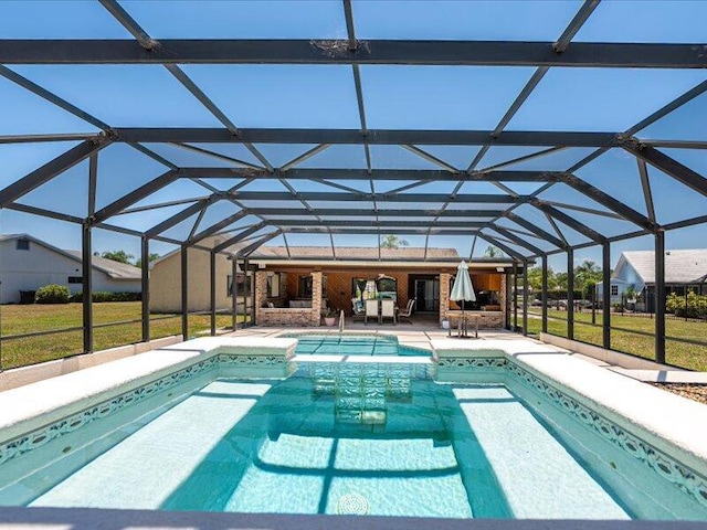 1821 SE Hanby Ave, Port Saint Lucie, FL 34952 - swimming pool featuring a patio area and glass enclosure