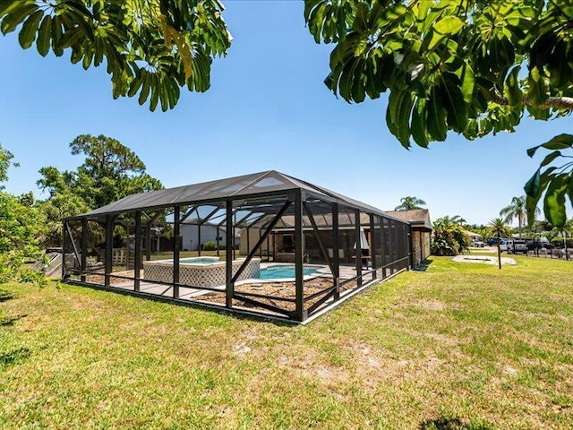 1821 SE Hanby Ave, Port Saint Lucie, FL 34952 - swimming pool with a lawn and a lanai