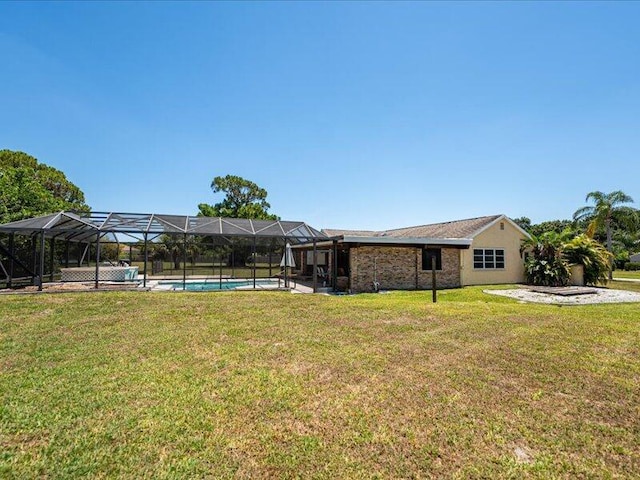 1821 SE Hanby Ave, Port Saint Lucie, FL 34952 - view of green lawn featuring an outdoor pool and glass enclosure