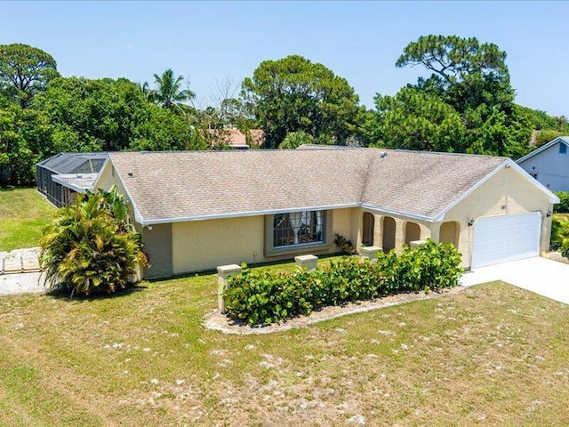 1821 SE Hanby Ave, Port Saint Lucie, FL 34952 - single story home featuring a garage, driveway, a front yard, and stucco siding