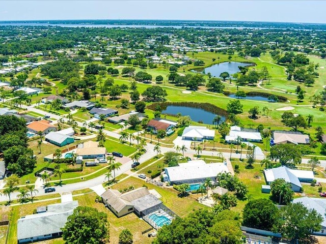 1821 SE Hanby Ave, Port Saint Lucie, FL 34952 - aerial perspective of suburban area featuring a nearby body of water and a local golf course