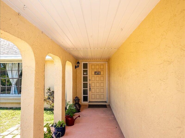 1821 SE Hanby Ave, Port Saint Lucie, FL 34952 - view of exterior entry with stucco siding