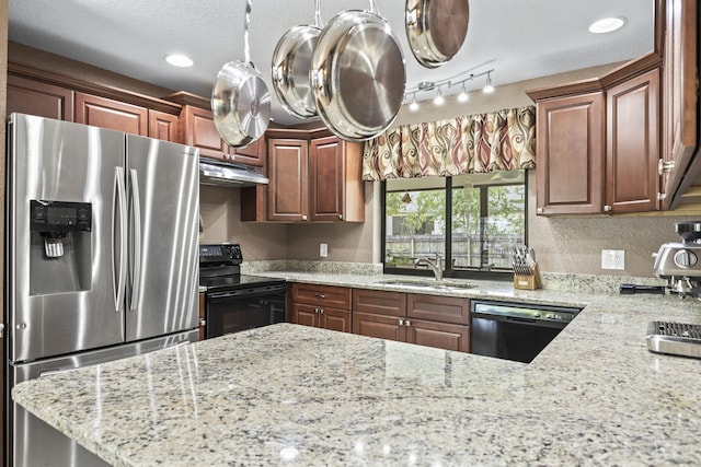 kitchen featuring black range with electric cooktop, under cabinet range hood, a sink, stainless steel fridge with ice dispenser, and dishwasher