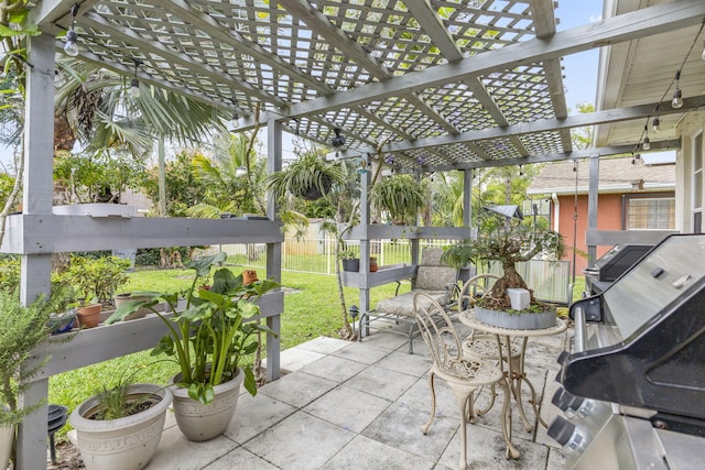 view of patio / terrace featuring fence, area for grilling, and a pergola