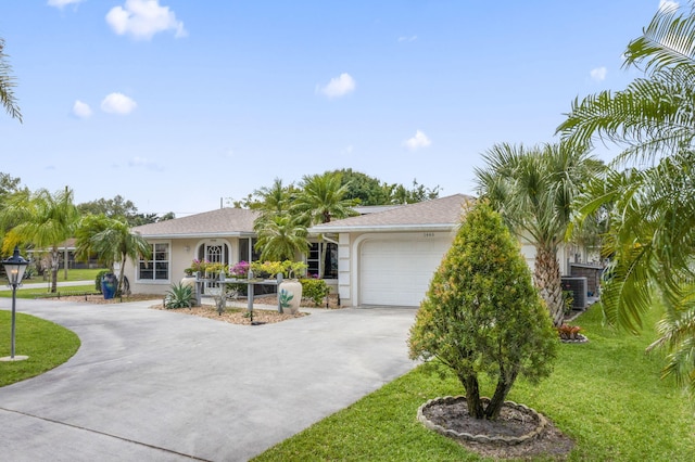 ranch-style home featuring an attached garage, driveway, a front lawn, and stucco siding