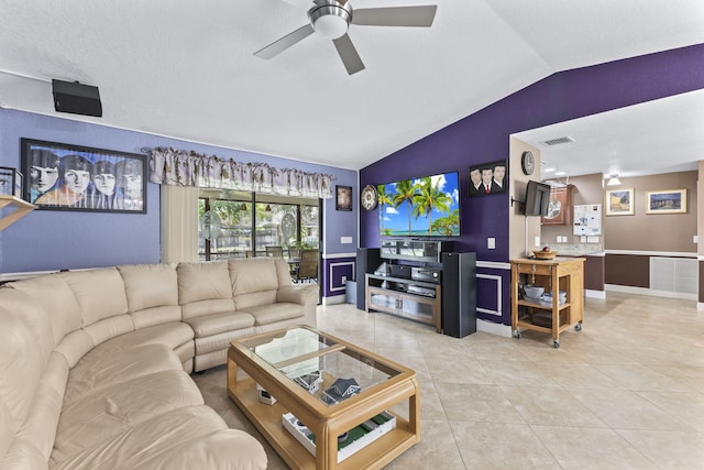 living room with lofted ceiling, light tile patterned floors, ceiling fan, and visible vents