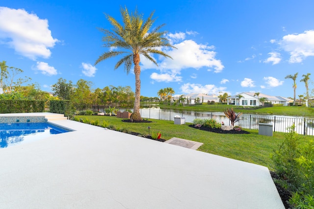 15730 Cedar Grove Ln, Wellington, FL 33414 - view of swimming pool featuring a fenced backyard, a water view, and a lawn