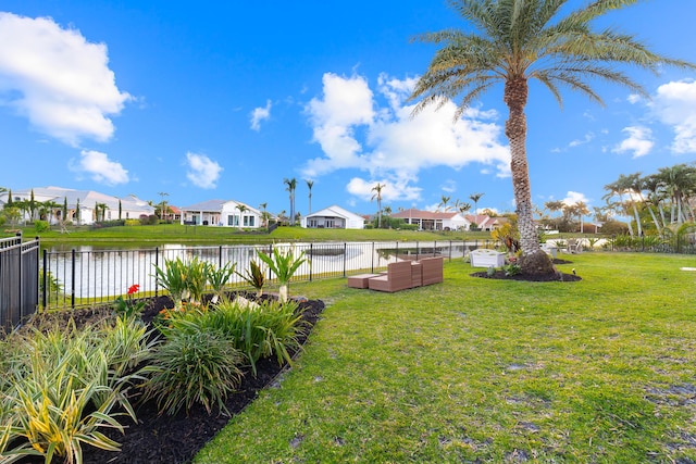 15730 Cedar Grove Ln, Wellington, FL 33414 - view of yard with a residential view, a water view, and fence