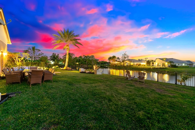 15730 Cedar Grove Ln, Wellington, FL 33414 - view of yard with a fenced backyard, outdoor dining space, and a water view