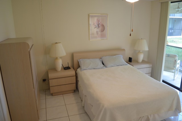 bedroom featuring multiple windows and light tile patterned floors