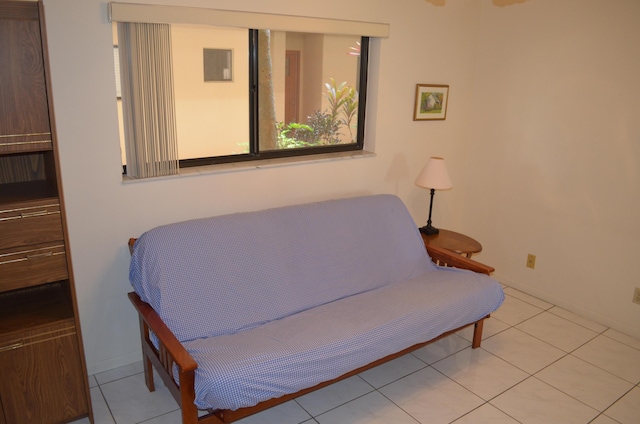 living area with tile patterned floors