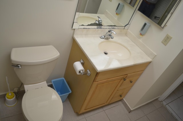 bathroom featuring vanity, toilet, and tile patterned floors