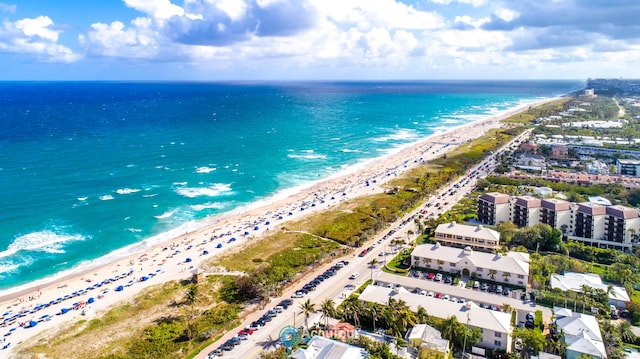 aerial view featuring a view of the beach and a water view