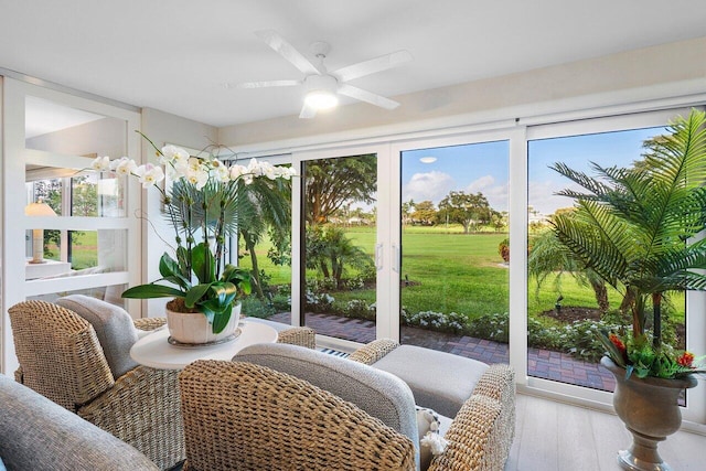 sunroom / solarium with ceiling fan