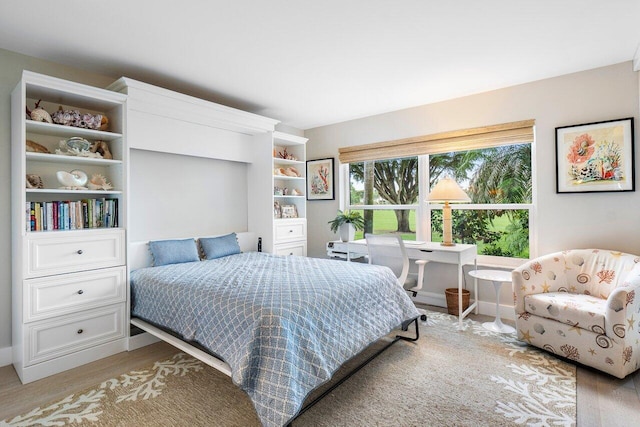 bedroom with wood finished floors