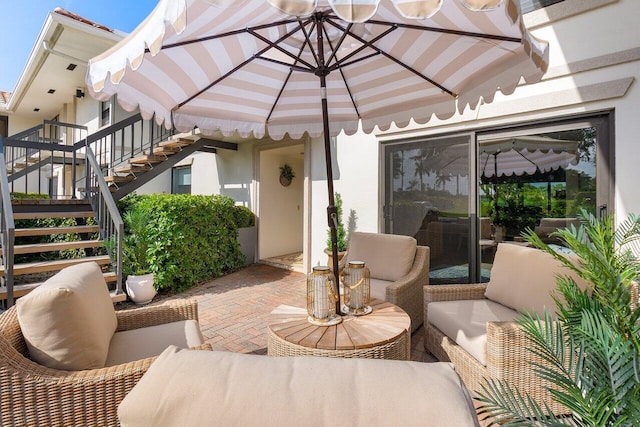 view of patio featuring stairway and an outdoor hangout area