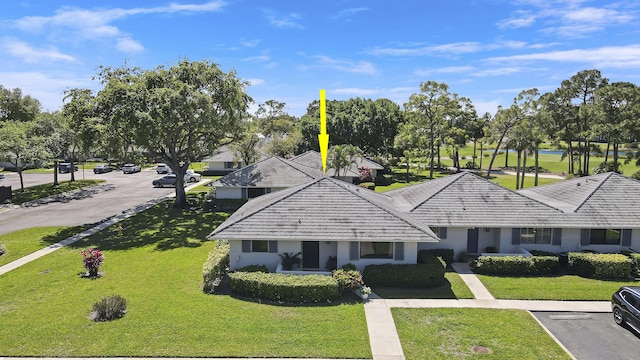 view of front of property featuring a front yard and stucco siding