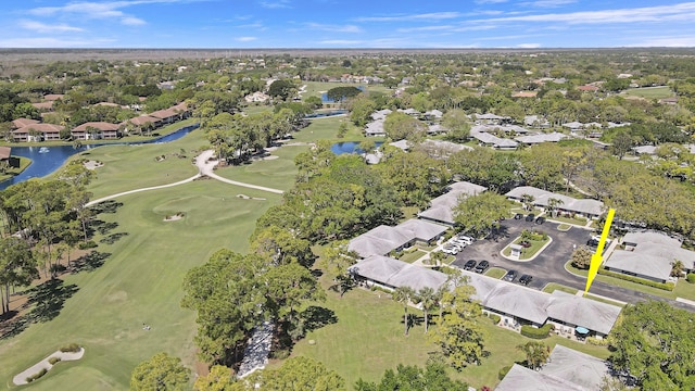 aerial view featuring a residential view, view of golf course, and a water view