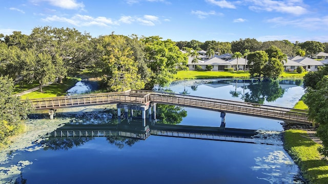 view of swimming pool featuring a water view