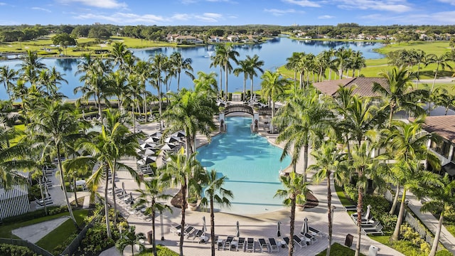 birds eye view of property with a water view