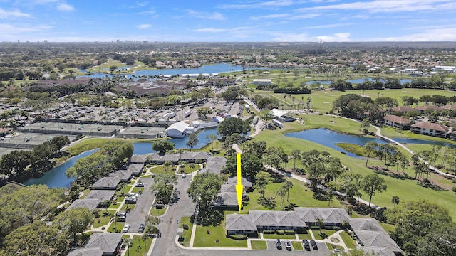 aerial view featuring view of golf course, a water view, and a residential view