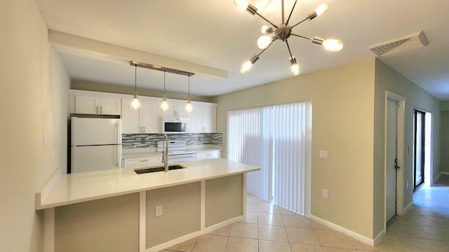 kitchen featuring tasteful backsplash, visible vents, white cabinetry, light tile patterned flooring, and white appliances