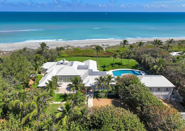 birds eye view of property featuring a view of the beach and a water view