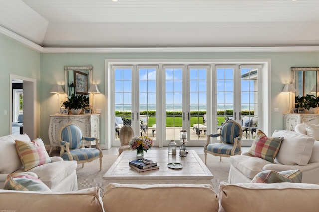 living room with french doors and a towering ceiling