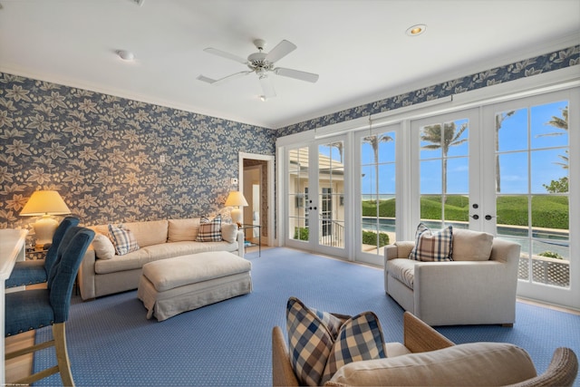 living area with ceiling fan, carpet floors, french doors, and wallpapered walls