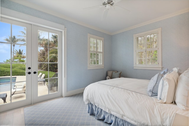 bedroom featuring access to exterior, baseboards, crown molding, and french doors