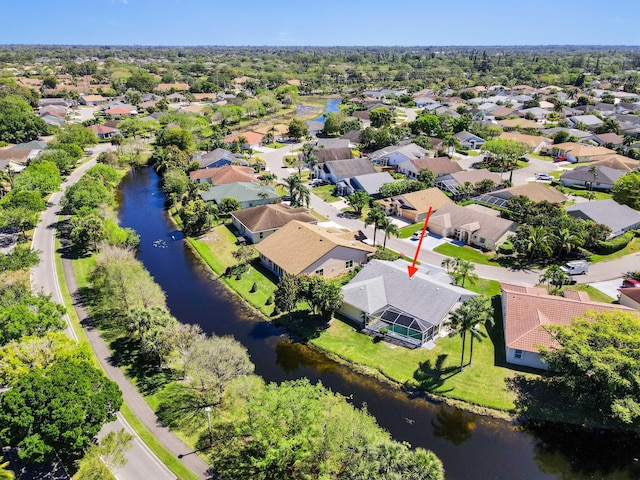 aerial view with a residential view and a water view